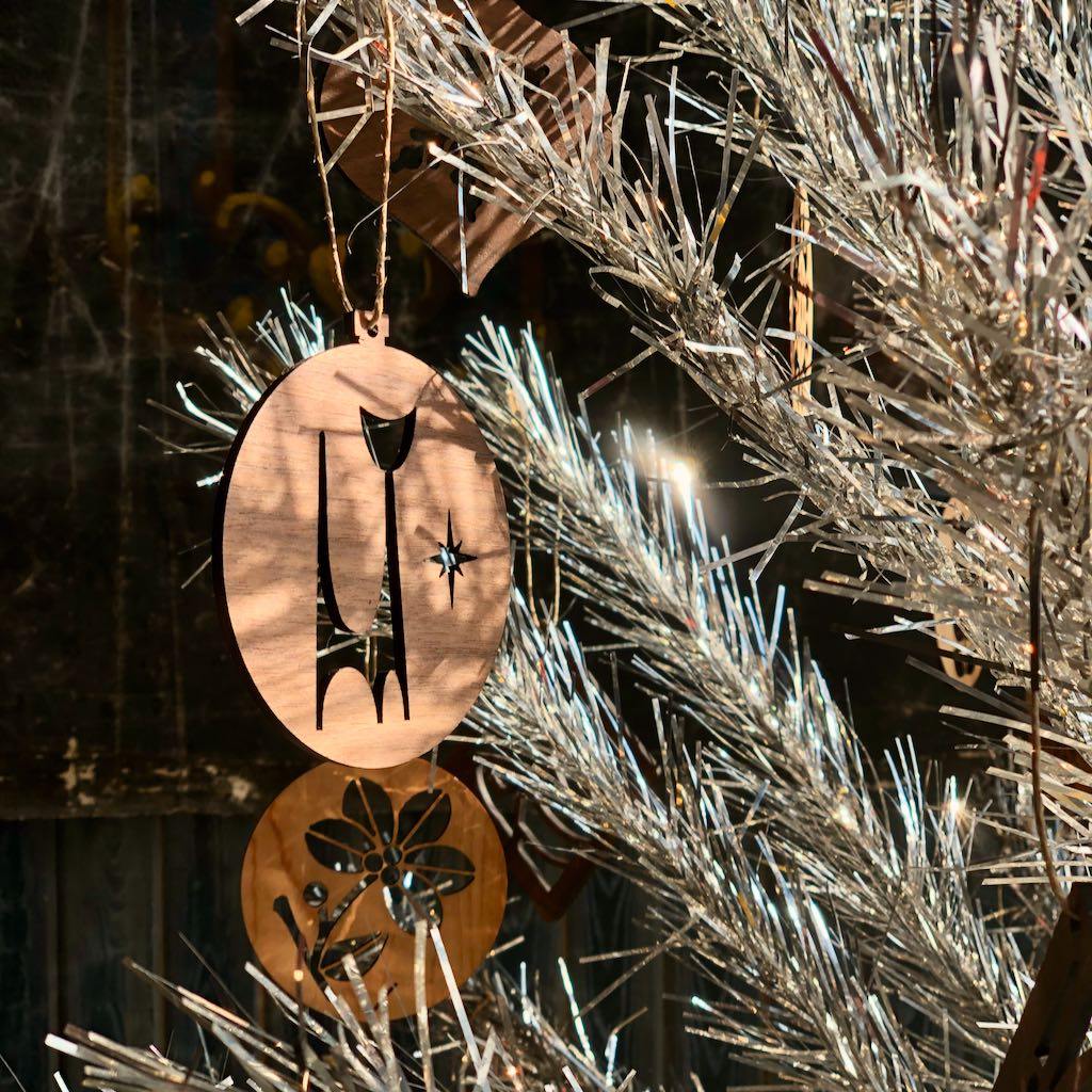 Our Atomic Age Ornament Collection contains emblems reminiscent of the 1950s and 1960s Atomic Age of the mid-century. These Christmas ornaments are both beautiful for your own decorations and great gifts for family or friends.